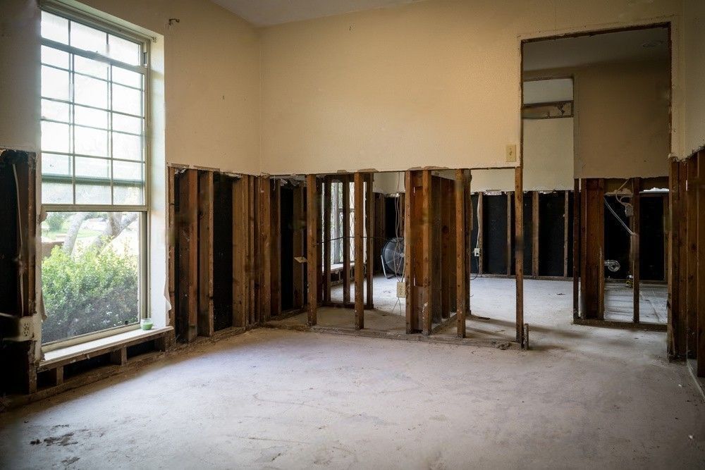 Interior of a home post-Hurricane, showing the repair process with damaged walls being removed