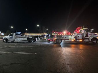 SWFT Towing heavy-duty tow truck towing a large vehicle - Heavy-duty towing services for trucks and equipment.