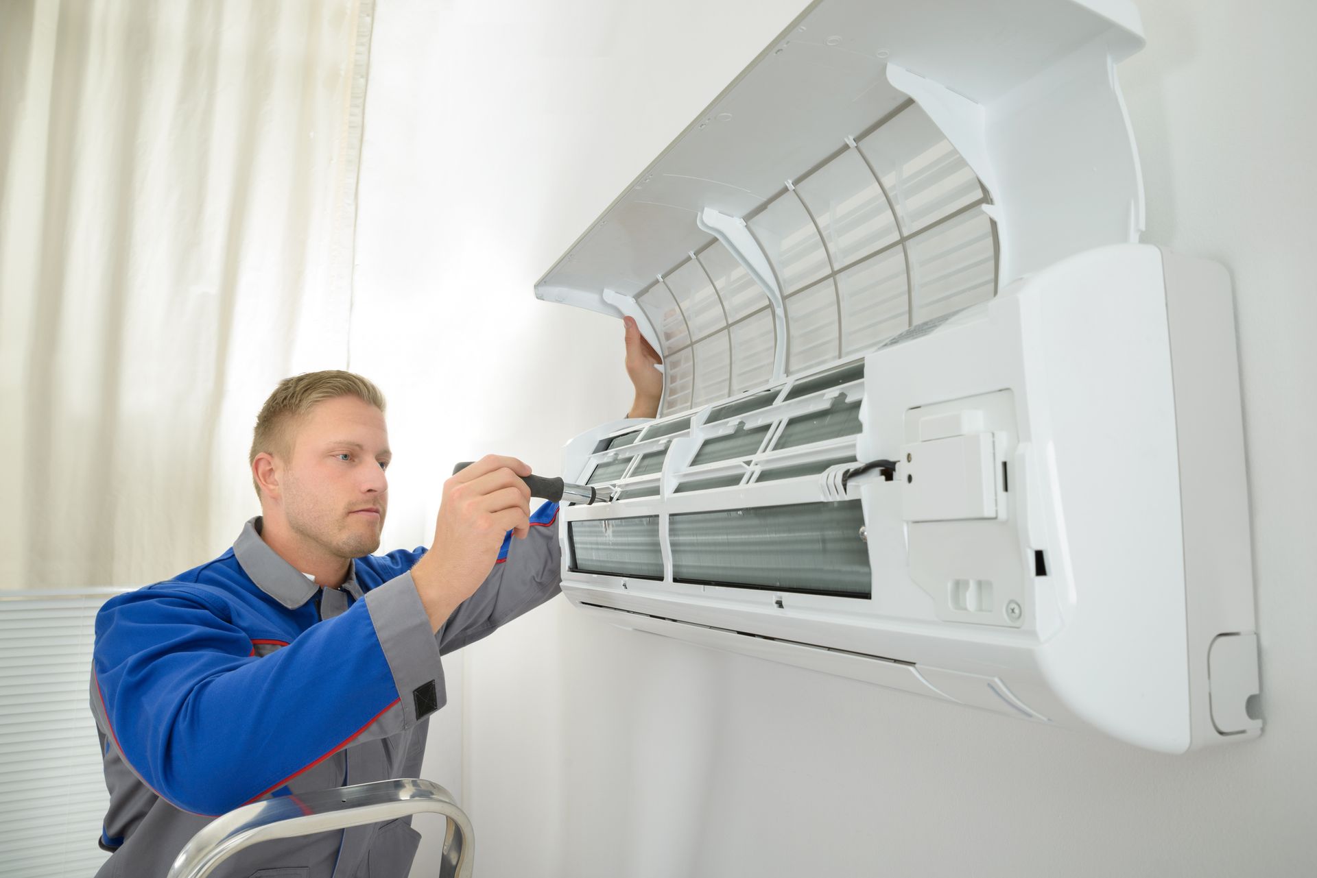 Modtech HVAC technician doing an AC tune-up. 