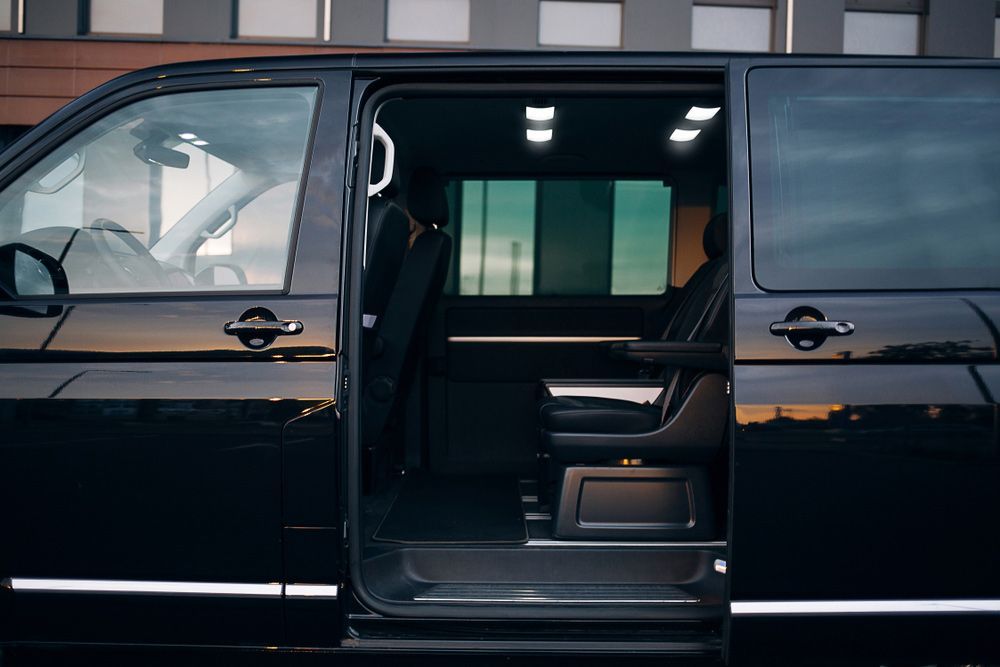 Black Van With Open Sliding Door — Dave's Drive U Anywhere 24/7 Mini Van Hire In Shellharbour, NSW