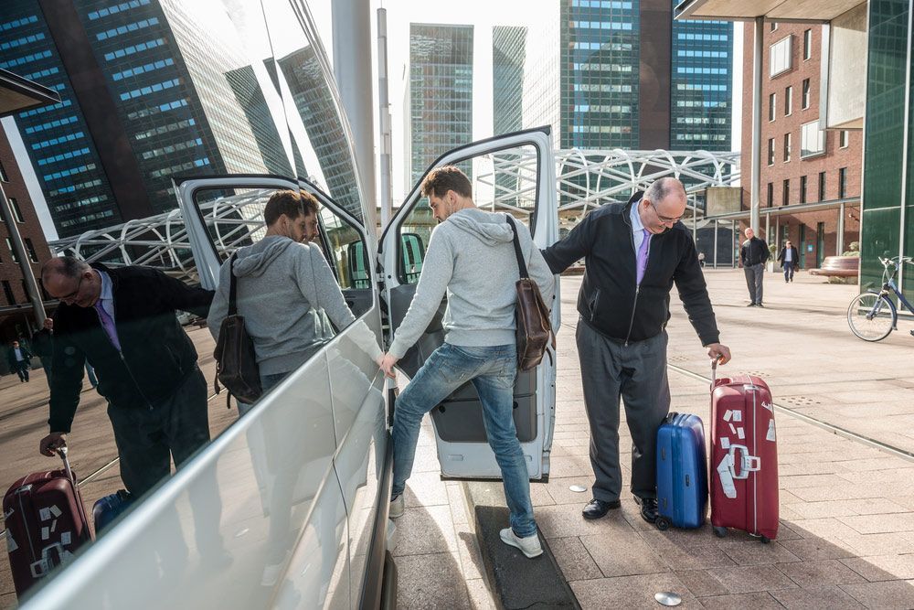 People Exiting a Van in a City — Dave's Drive U Anywhere 24/7 Mini Van Hire In Wollongong, NSW