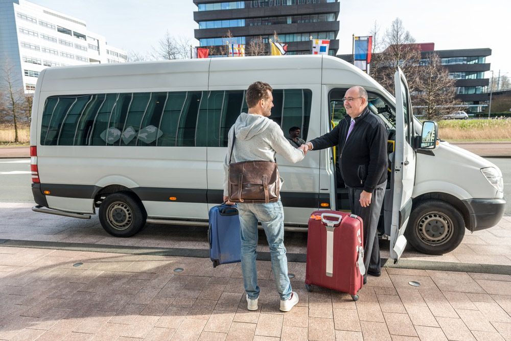 Man Shaking Hands With a Driver — Dave's Drive U Anywhere 24/7 Mini Van Hire In Austinmer, NSW