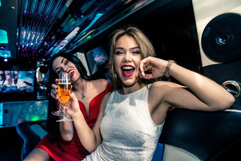 Two Women in a Limousine — Dave's Drive U Anywhere 24/7 Mini Van Hire In Wollongong, NSW