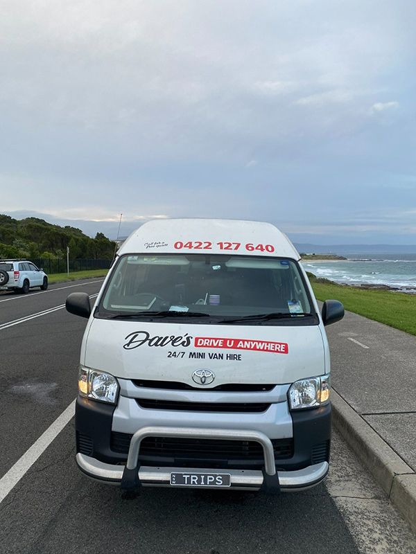 A White Van Is Parked on The Side of The Road — Daves Drive U Anywhere in Wollongong, NSW
