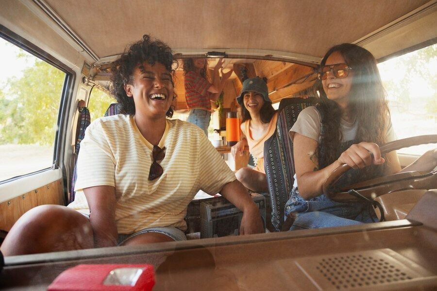 Three Women Laugh Joyfully — Dave's Drive U Anywhere 24/7 Mini Van Hire In Wollongong, NSW