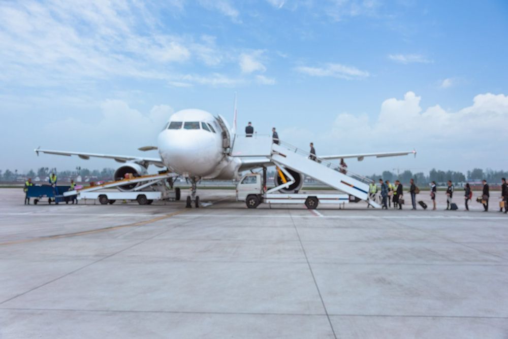 Airplane on Tarmac — Dave's Drive U Anywhere 24/7 Mini Van Hire In Wollongong, NSW