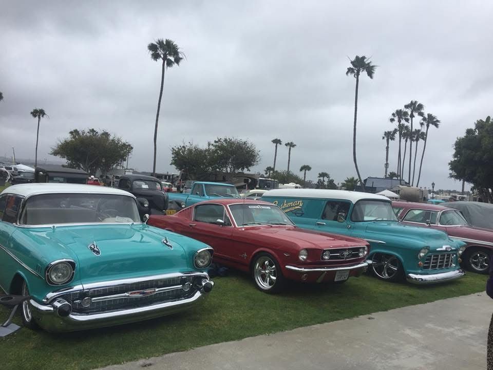 Classic Cars Parked in Front of Ed Hanson's Muffler Service