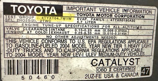 A rectangular Toyota vehicle emission control information label with technical specifications for a 2004 4.7L engine.