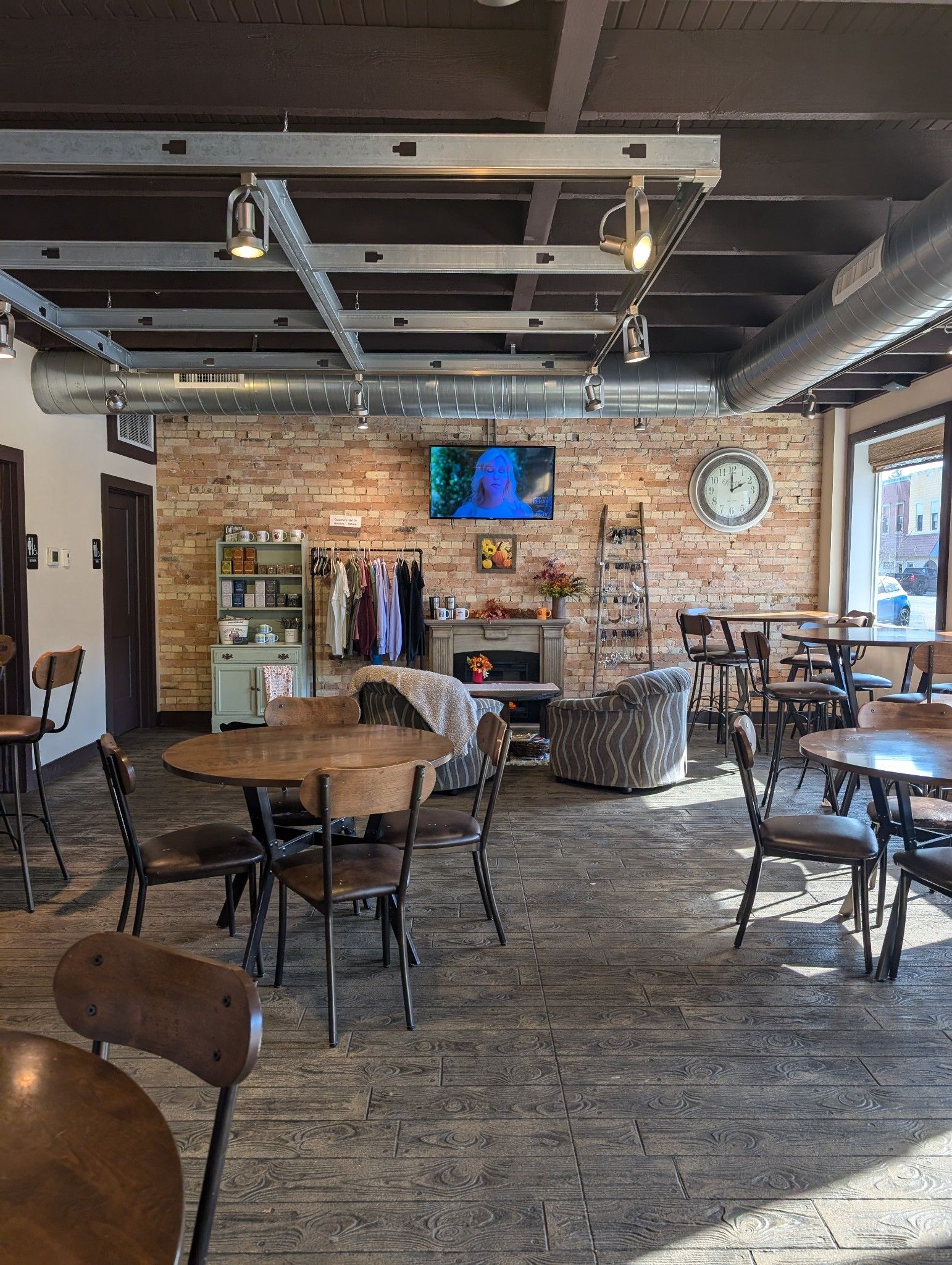 A panoramic view of a restaurant with tables and chairs.