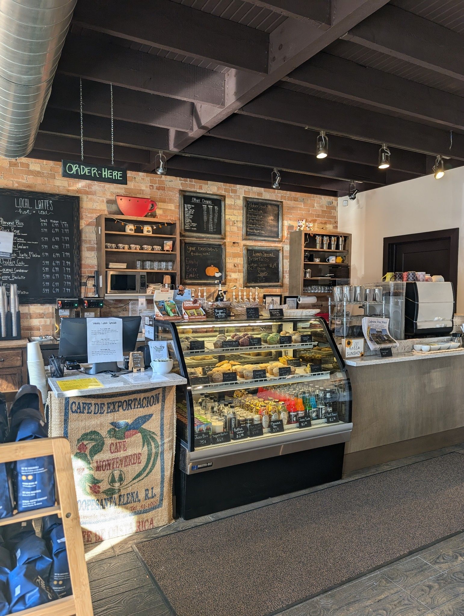 A chalkboard menu for village kumps coffee and hot coffee