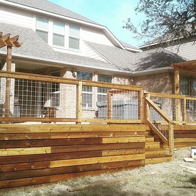 custom wood deck with fence railing