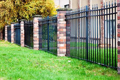 custom wrought iron brick fence