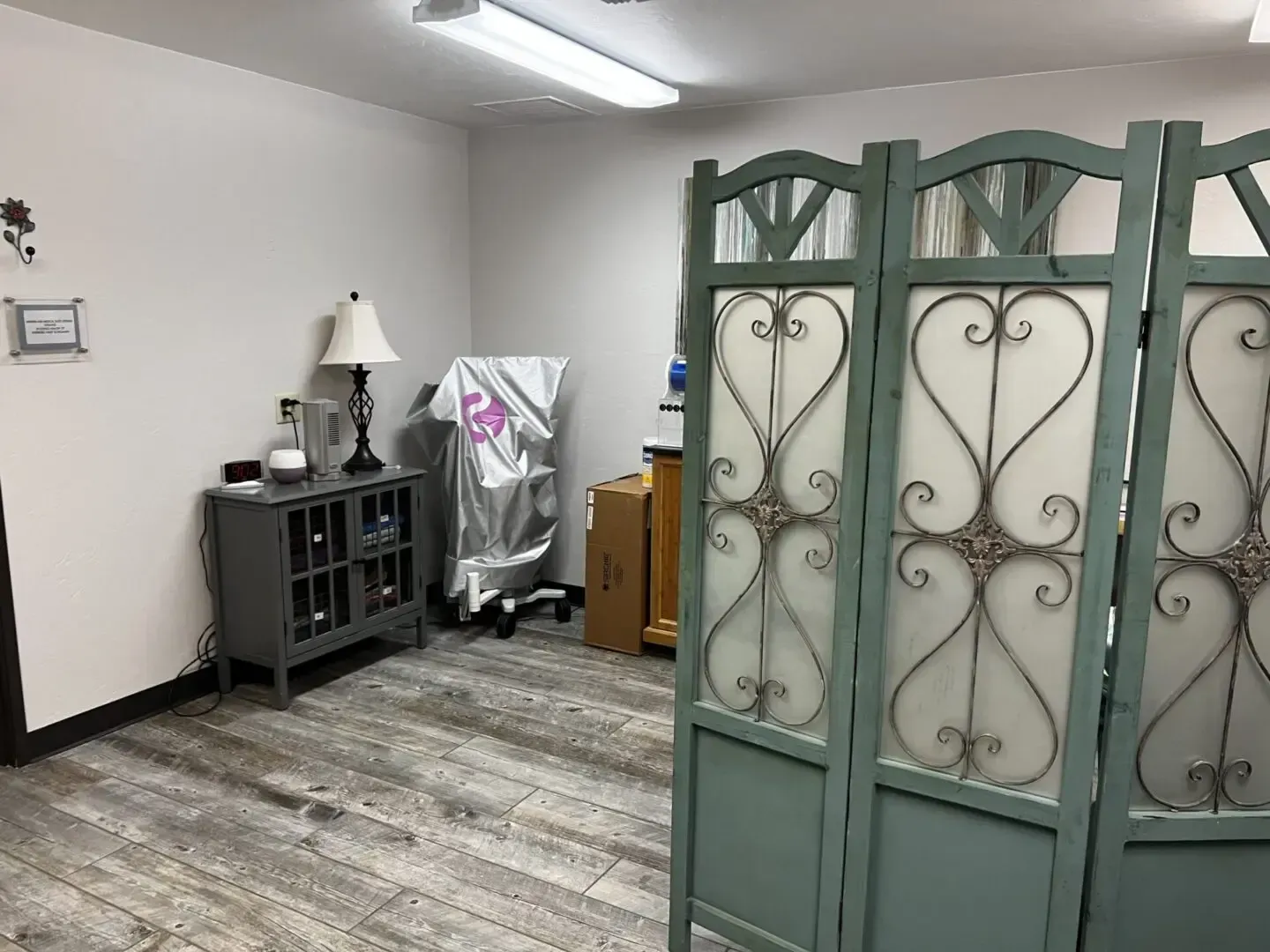 There is a room divider in the middle of the room.