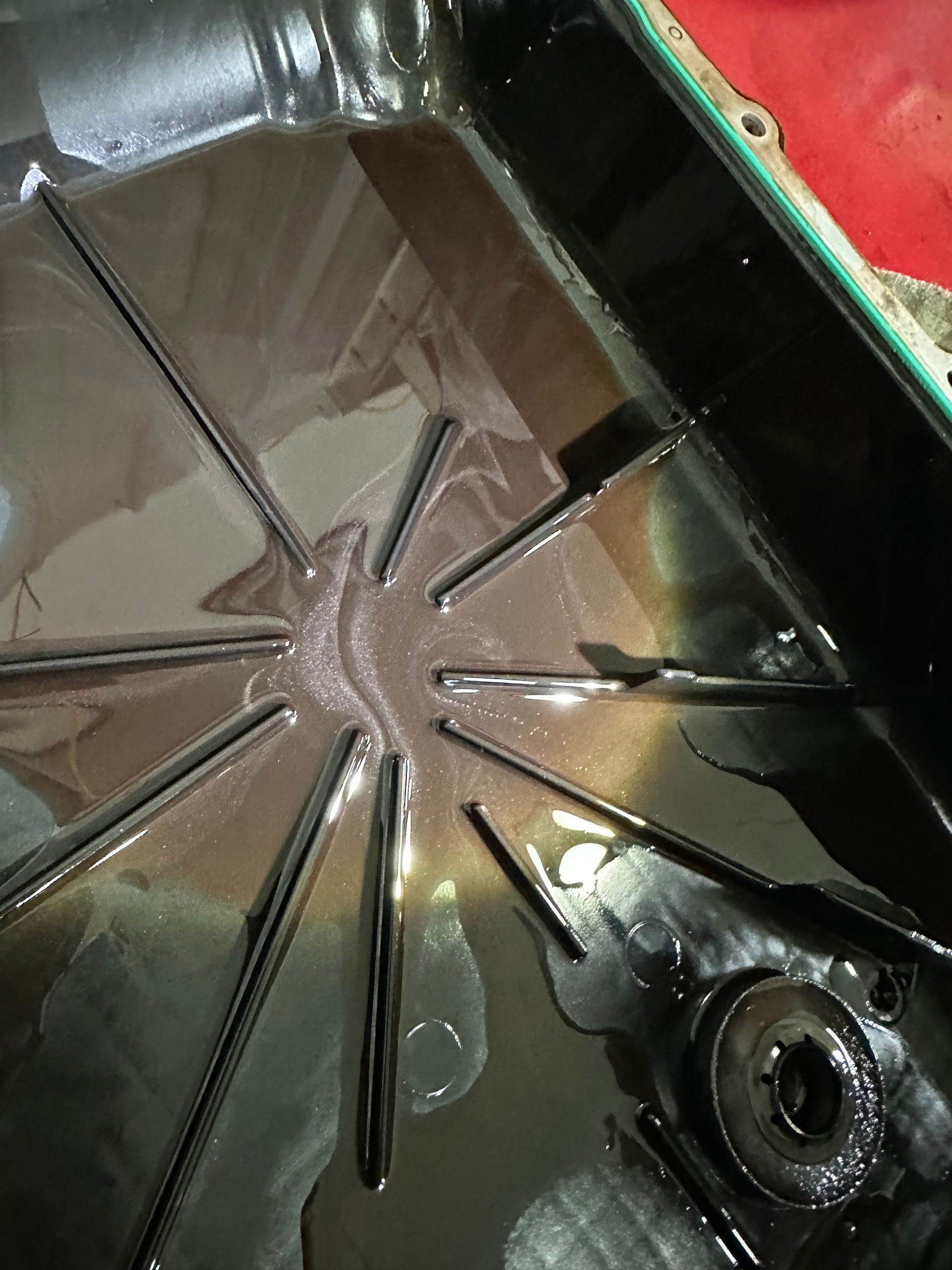 Clean transmission pan compared with a pan containing debris from an internal transmission failure