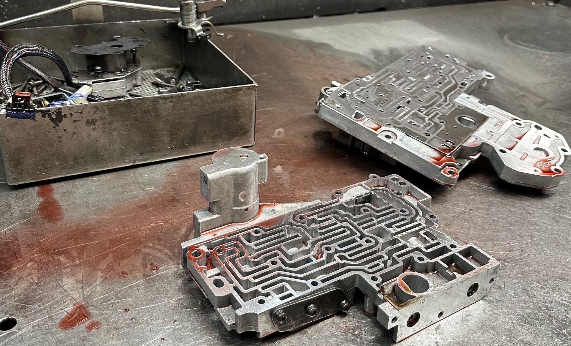 Automatic transmission valve body disassembled for inspection and vacuum testing