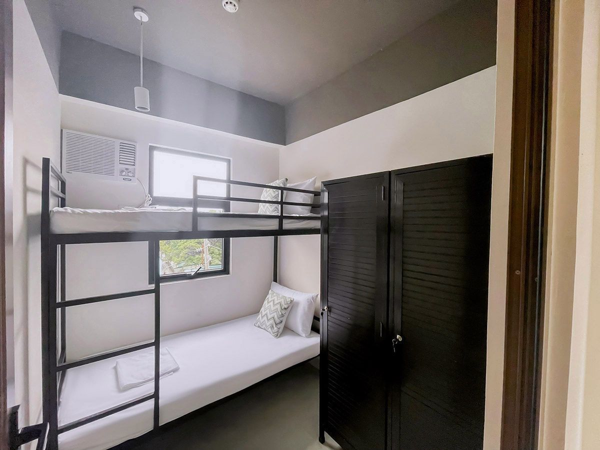 The Grid in Makati: There is a bunk bed in the corner of the room.
