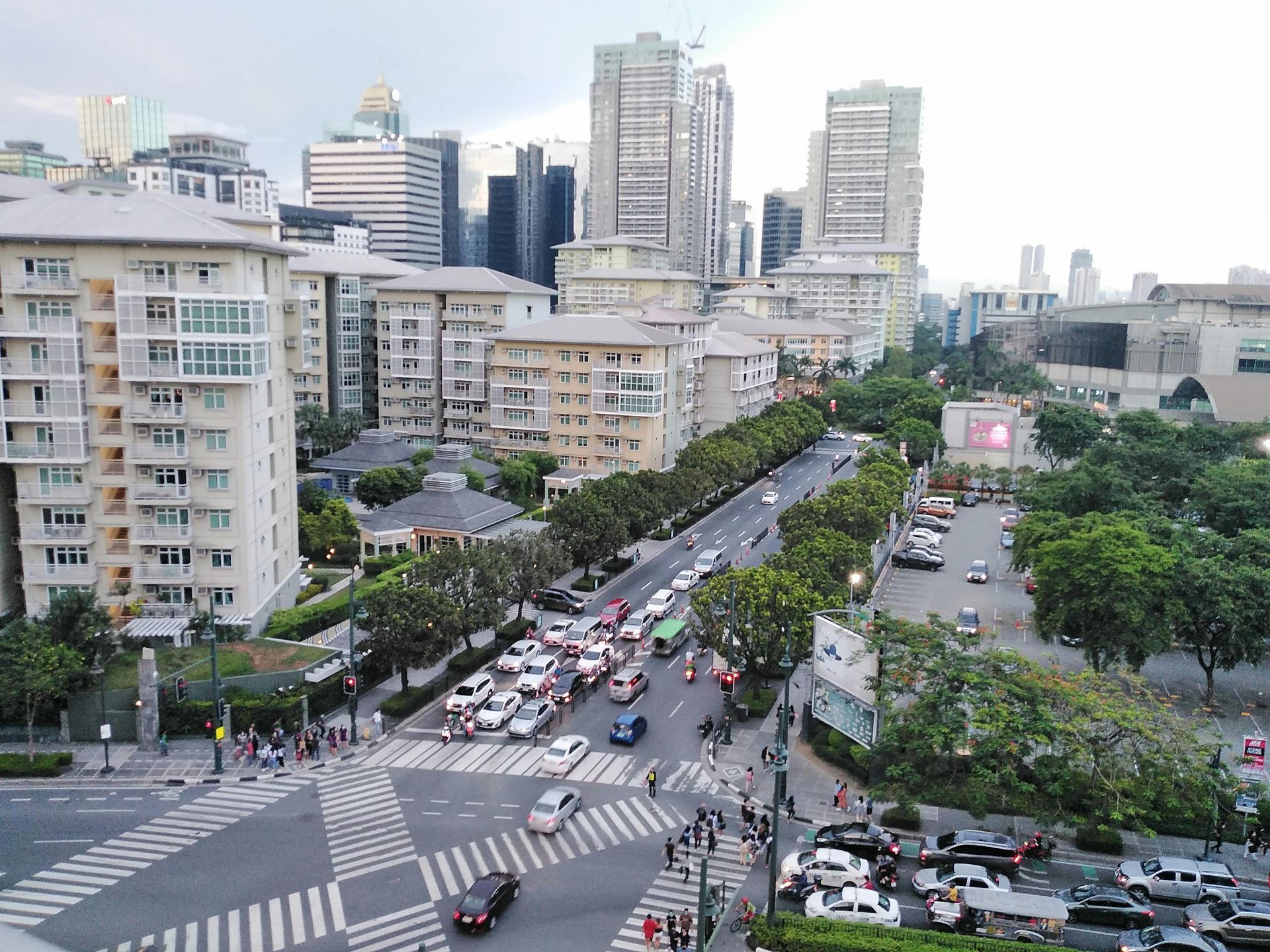 Aerial view of busy Makati CBD streets with residential buildings