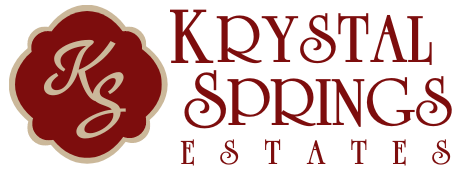 Krystal Springs Estates logo with burgundy emblem and text on white background