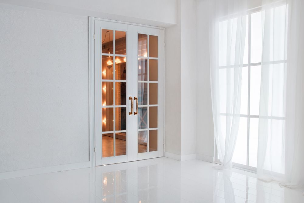 There Are Two French Doors in the Corner of the Room — Curtain Haven & Blinds in Port Macquarie, NSW