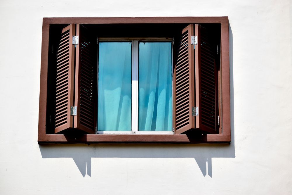 A Window With Shutters Open on a White Wall — Curtain Haven & Blinds in Port Macquarie, NSW