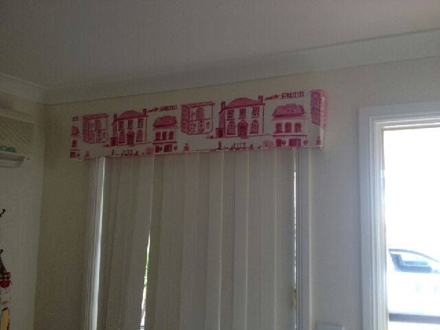 A White Window With a Red and White Curtain Hanging Over It — Curtain Haven & Blinds in Laurieton, NSW