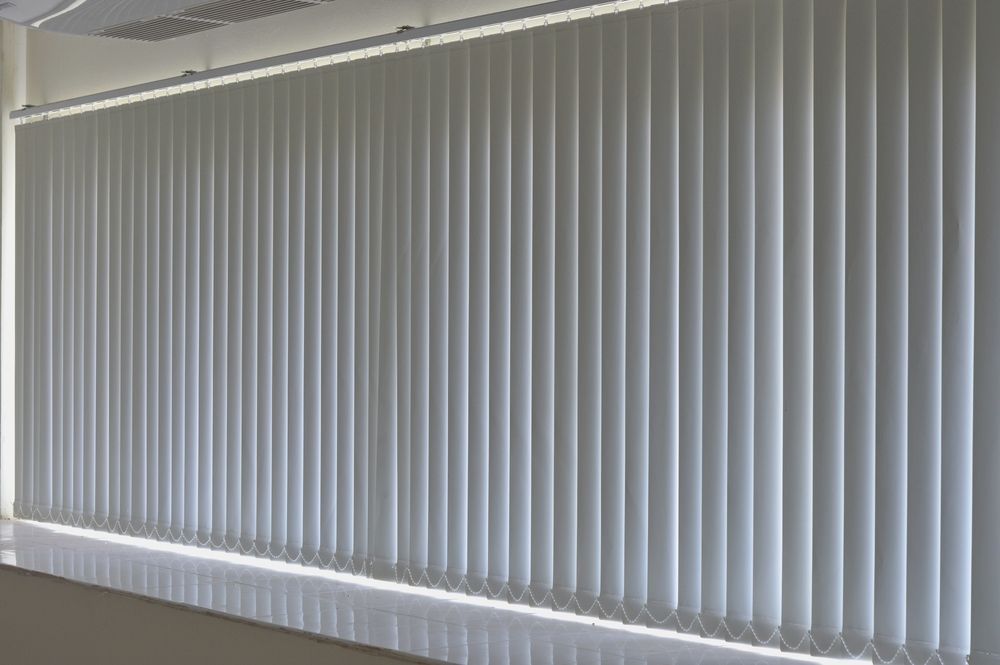 A Room With a Lot of Vertical Blinds on the Windows — Curtain Haven & Blinds in Wauchope, NSW