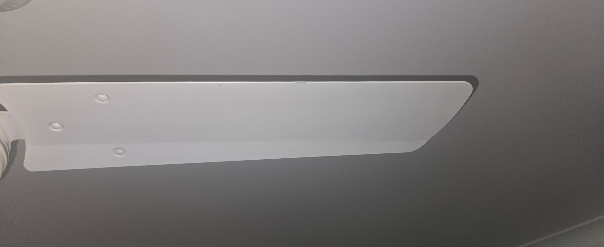 A clean white ceiling fan 