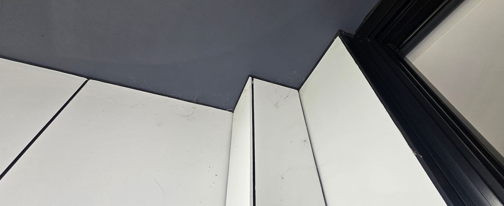 Outdoor ceiling dirty with cob webs and dust.