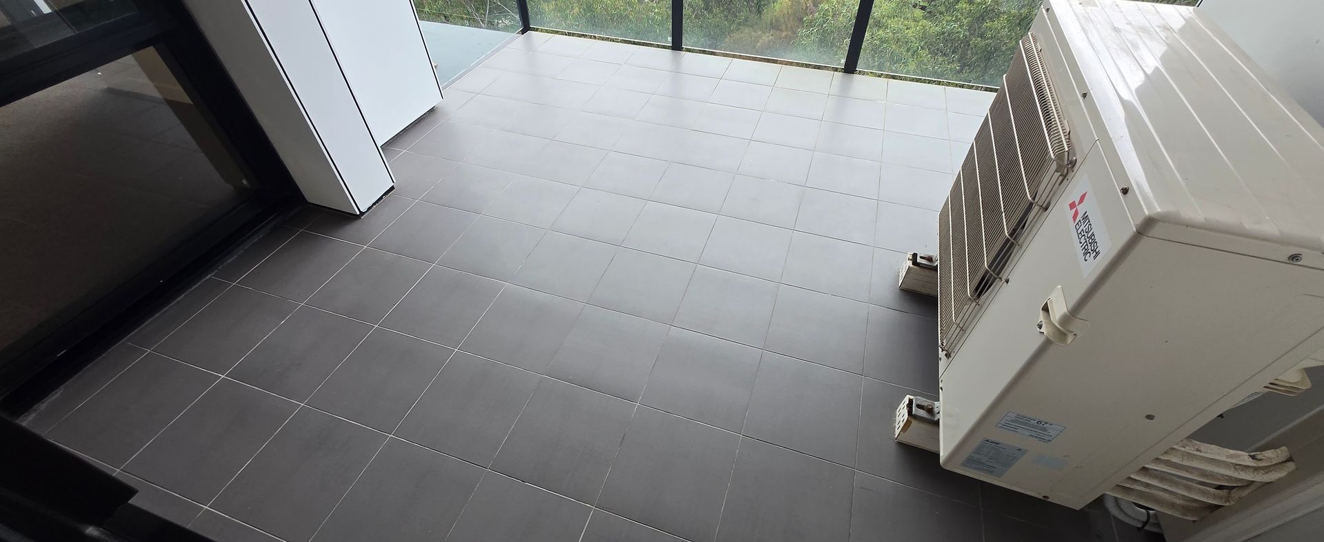 Cleaned balcony tiled floor, mopped.