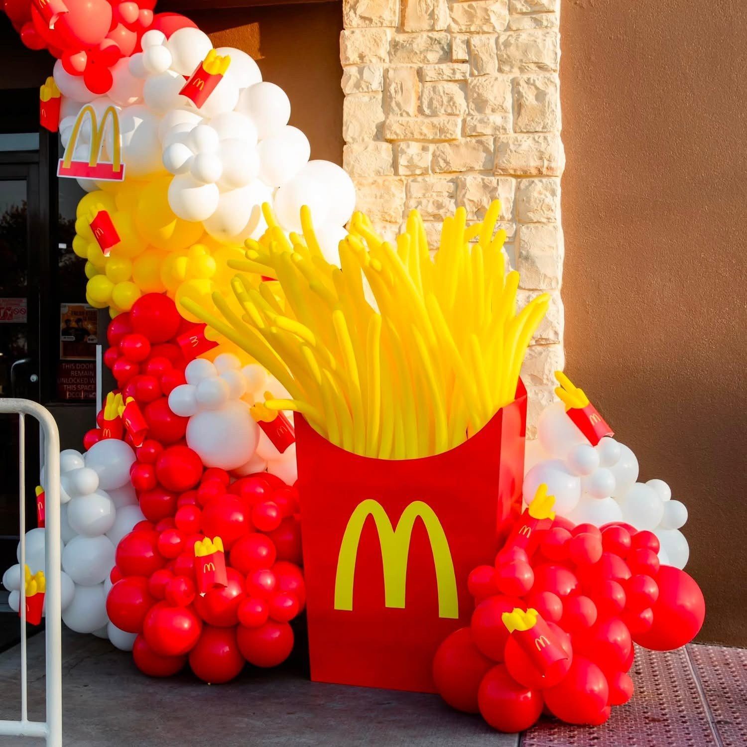McDonald’s French fries balloon sculpture outside a store entrance