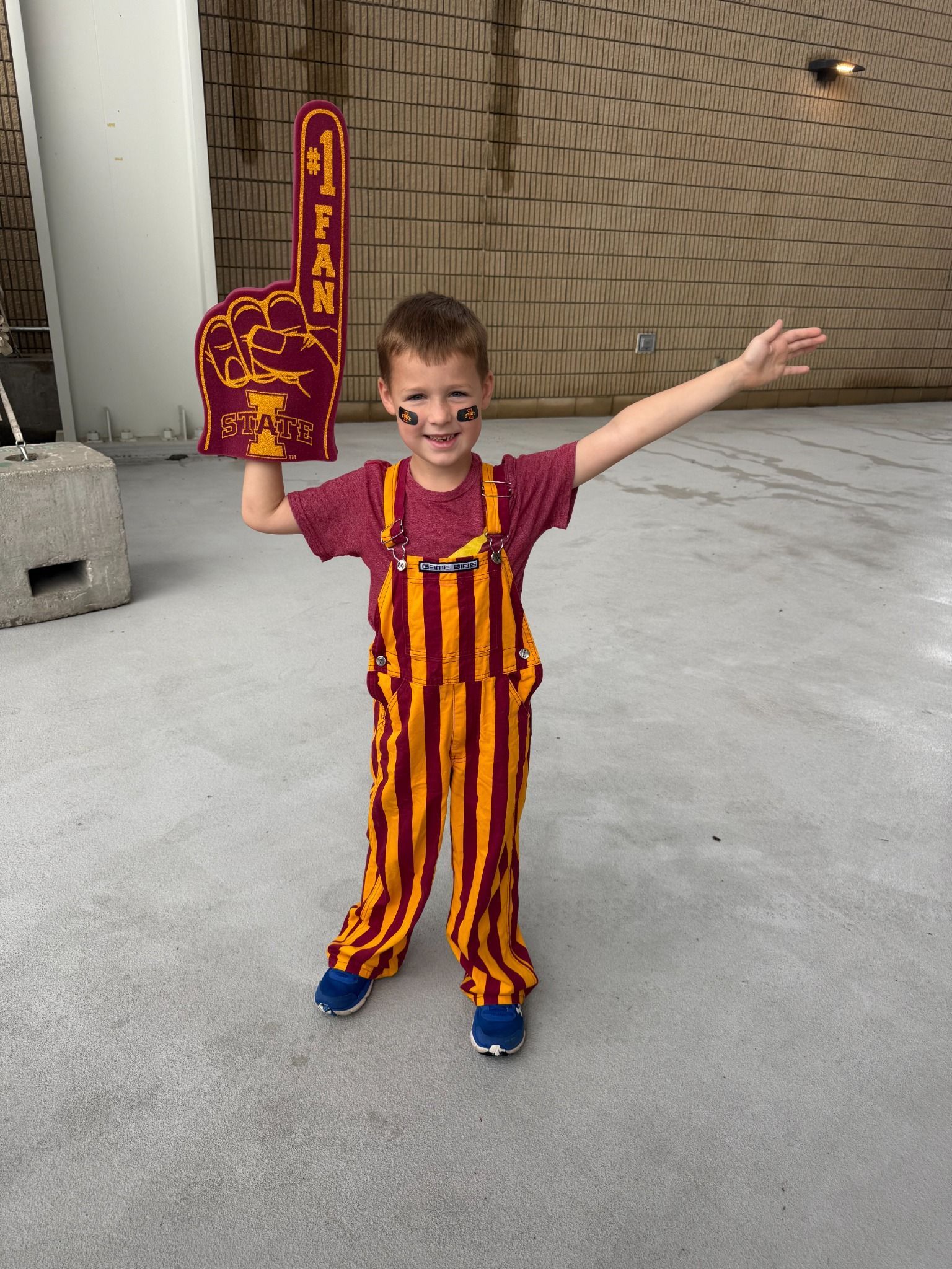 Hudson cheering with a foam finger