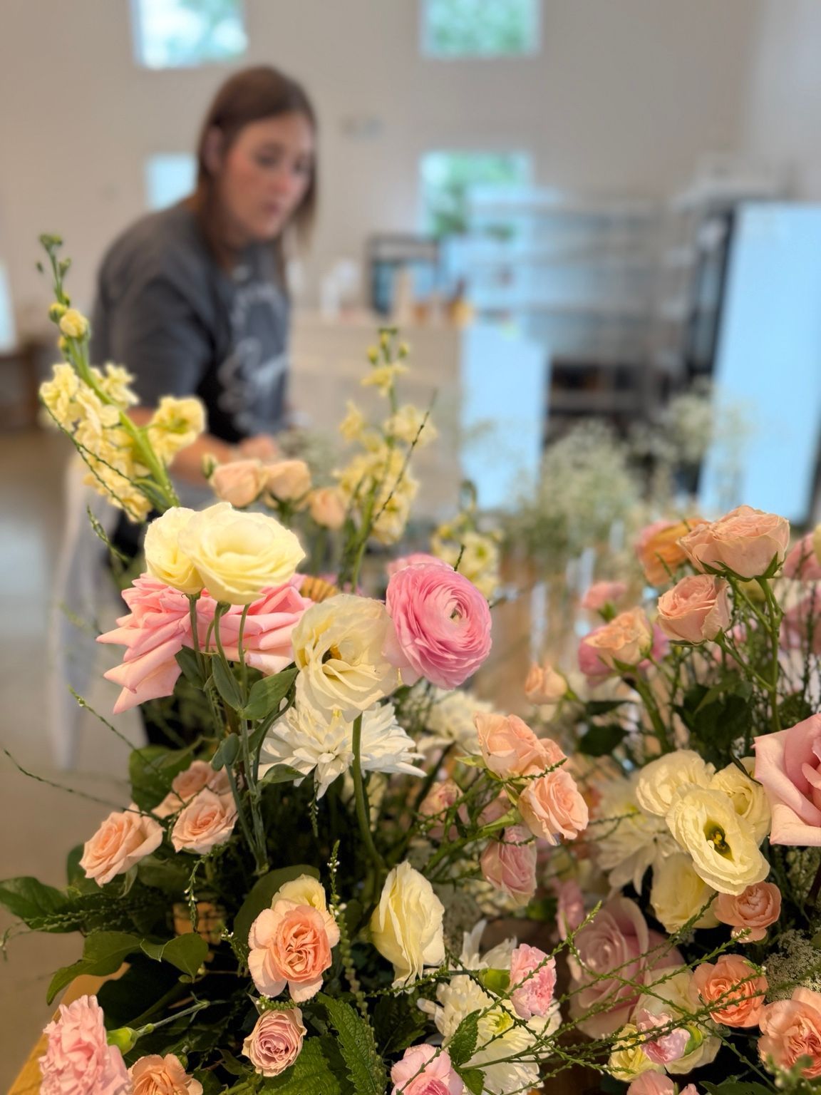 Pink, peach and cream fresh floral arrangements by Carmen’s Flowers Uptown