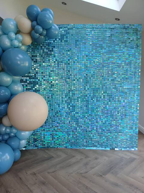Blue shimmer wall with balloon garland
