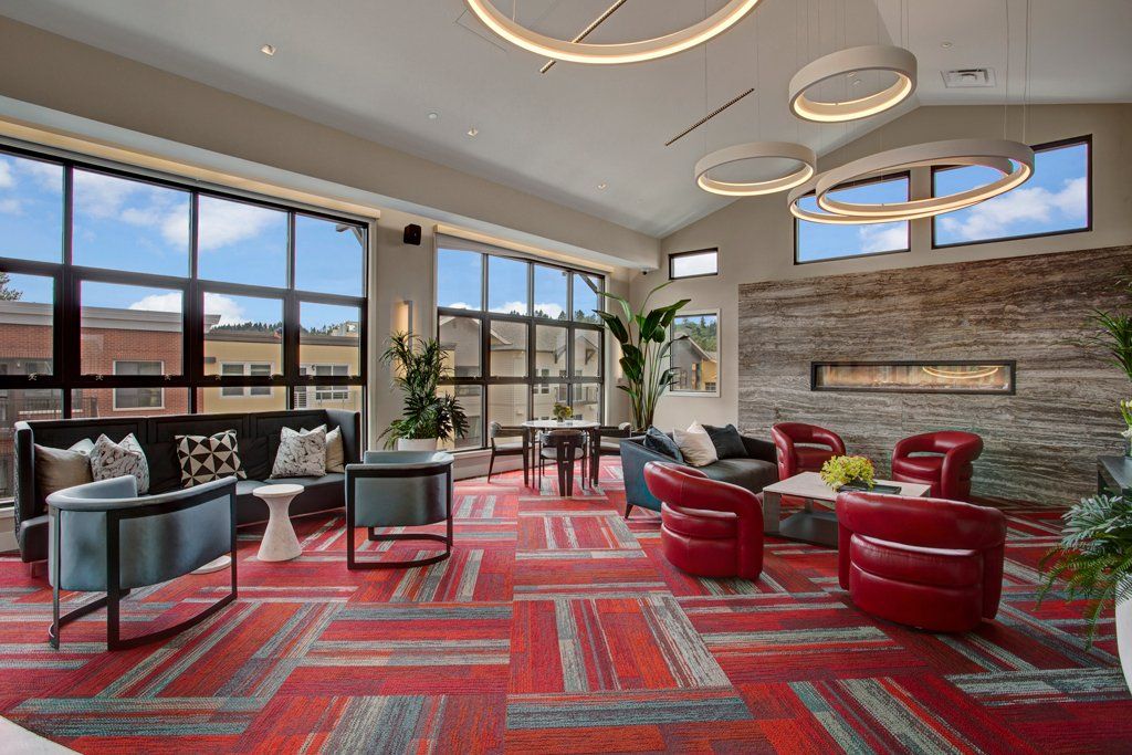A room filled with furniture and a fireplace at Woodin Creek Village.