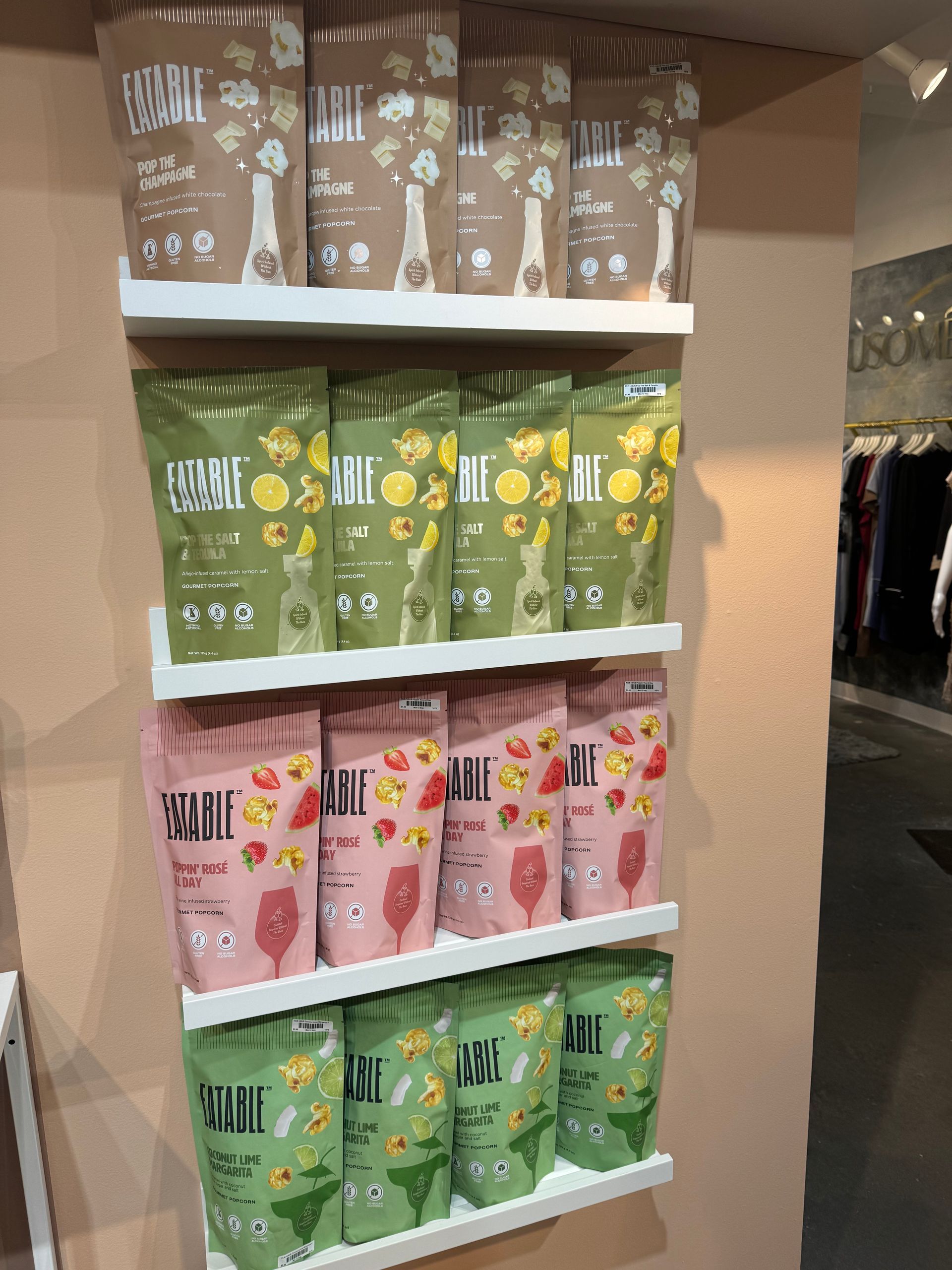 A shelf full of bags with one that says ' i love you ' on it