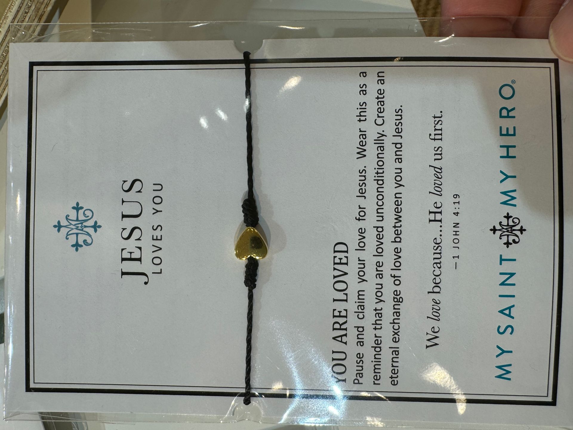 A card that says my saint my hero on it