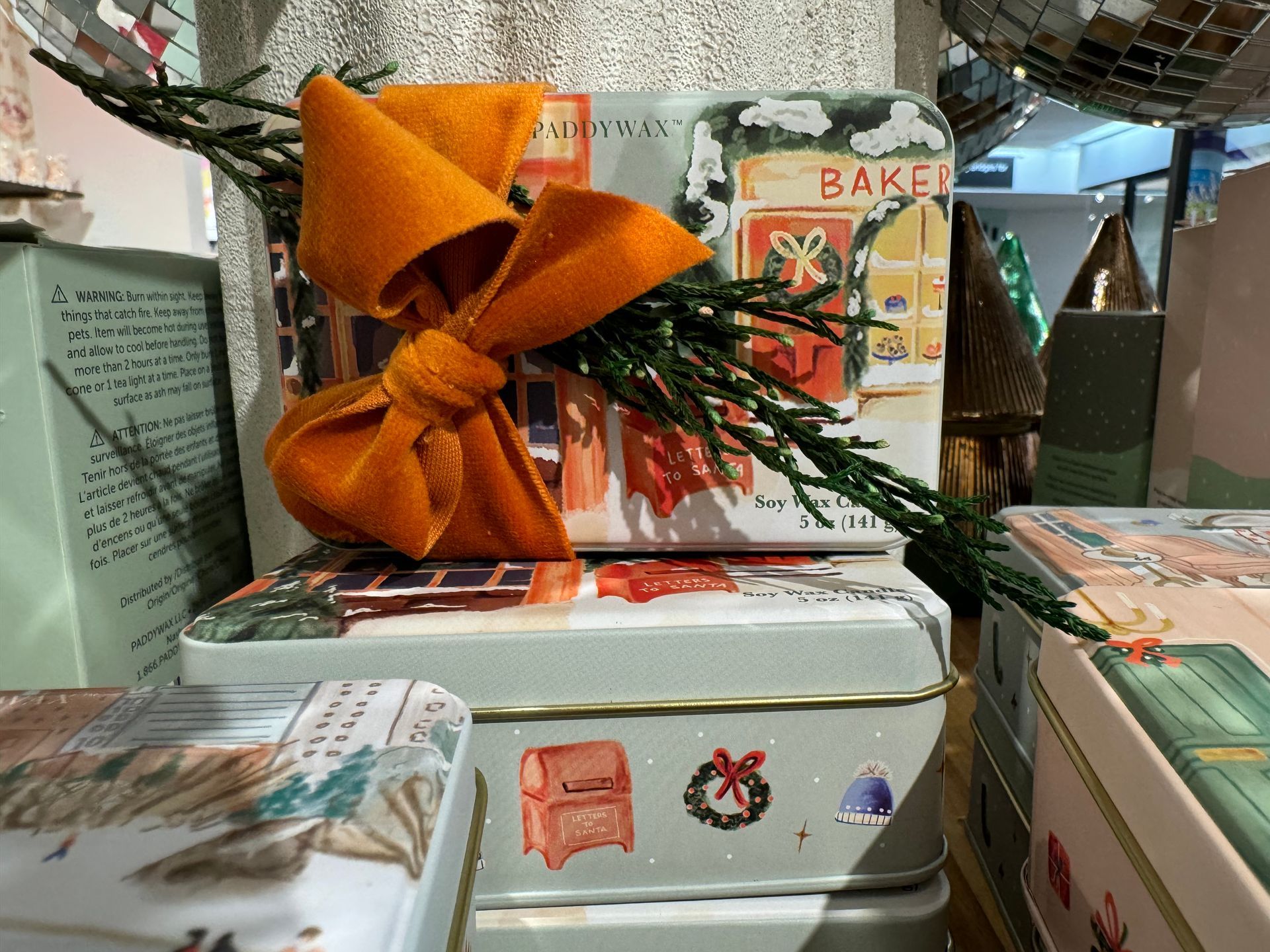 A stack of boxes with one that says baker on it
