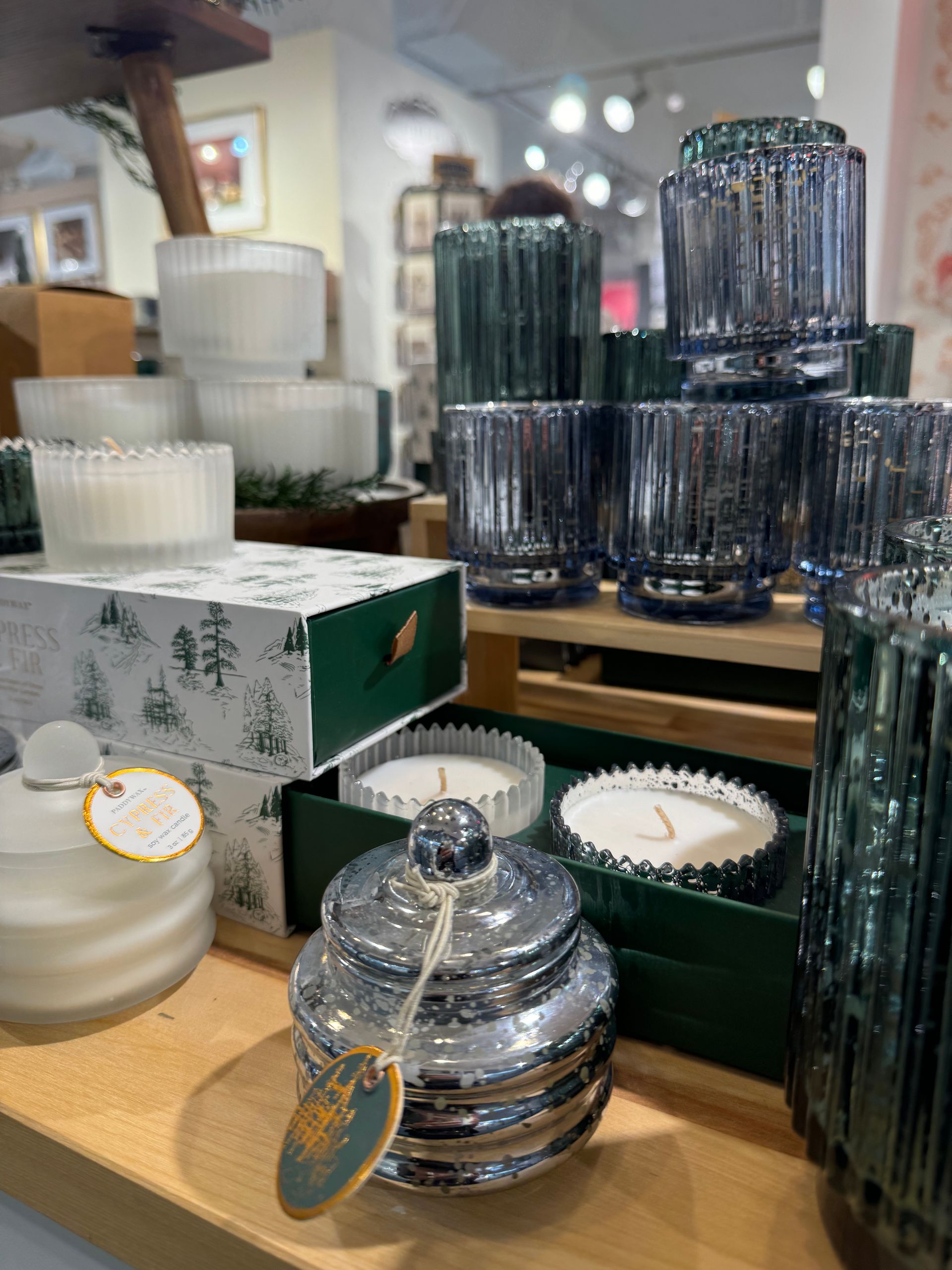 A display of candles and glasses in a store