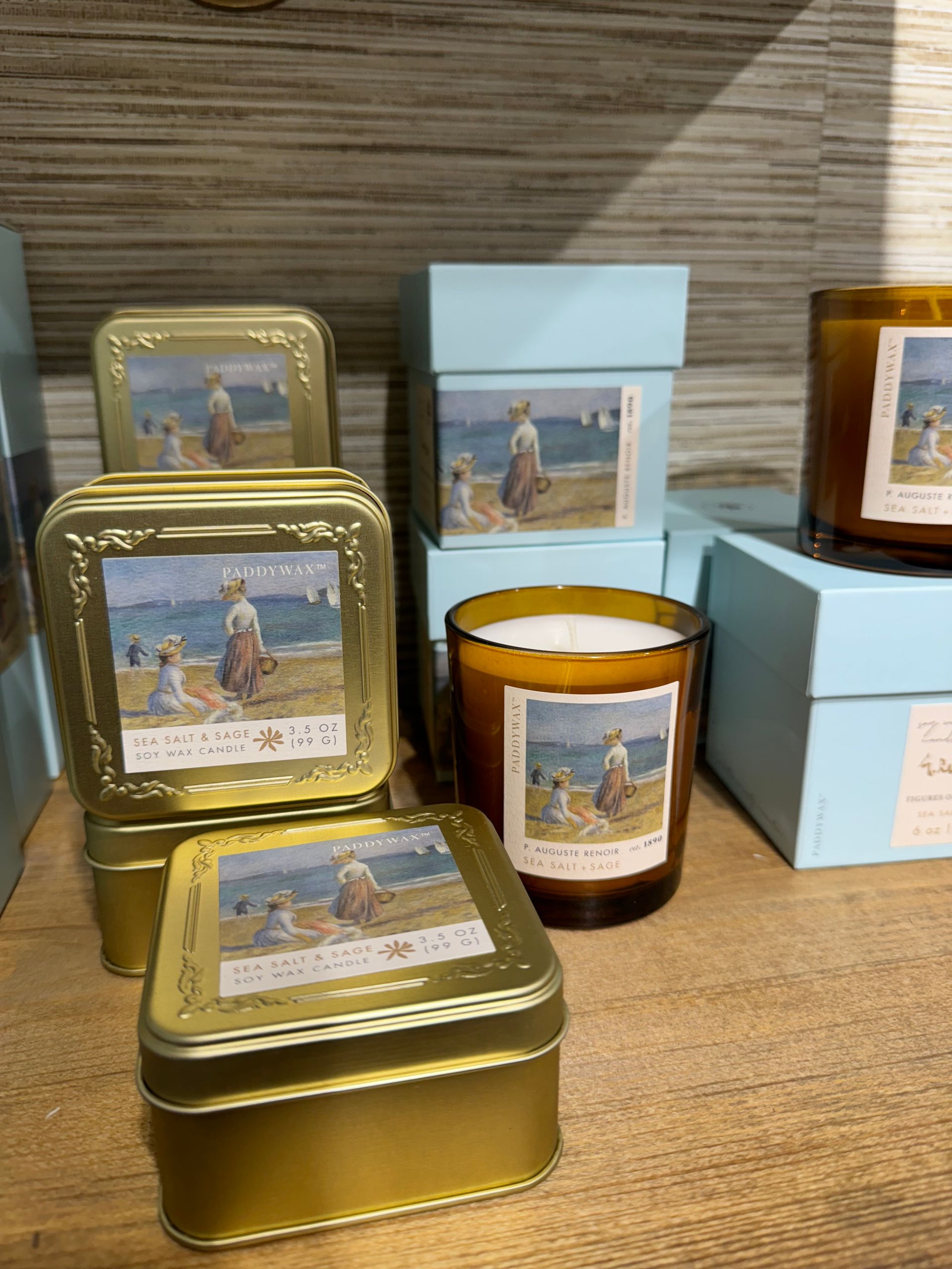 A display of candles with paintings on them