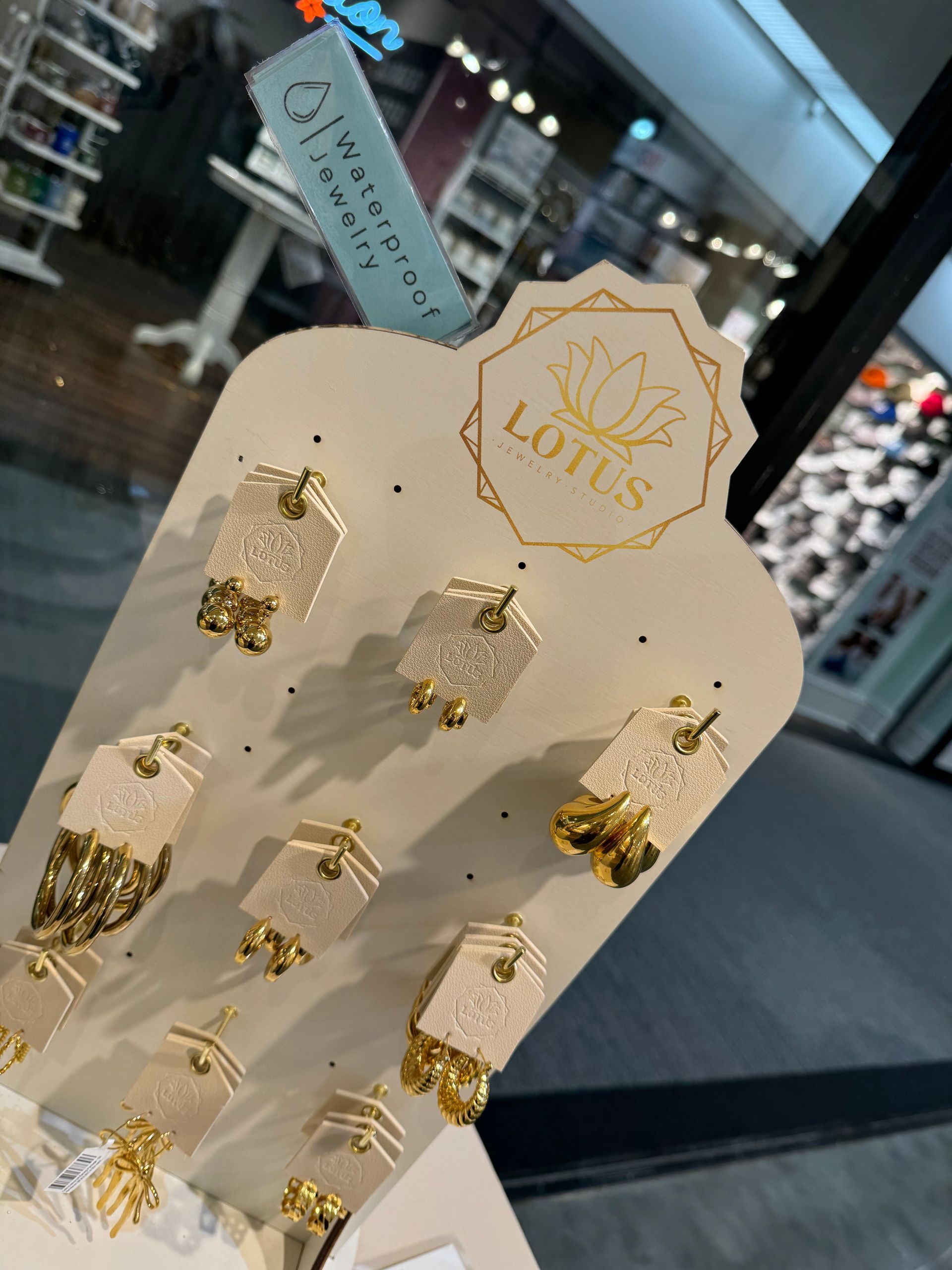 A display of lotus earrings and rings in a store
