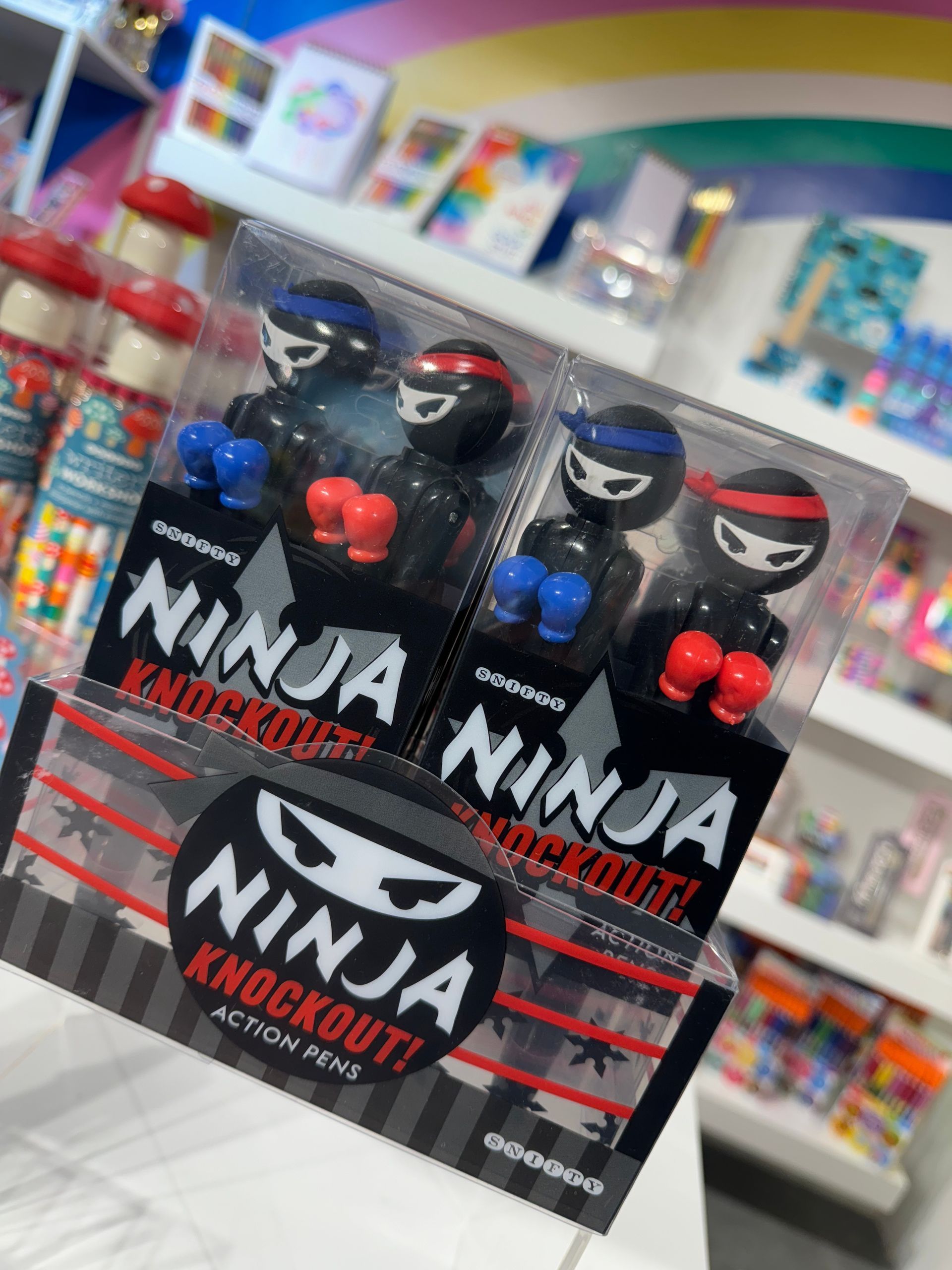 Two boxes of ninja knockout action figures