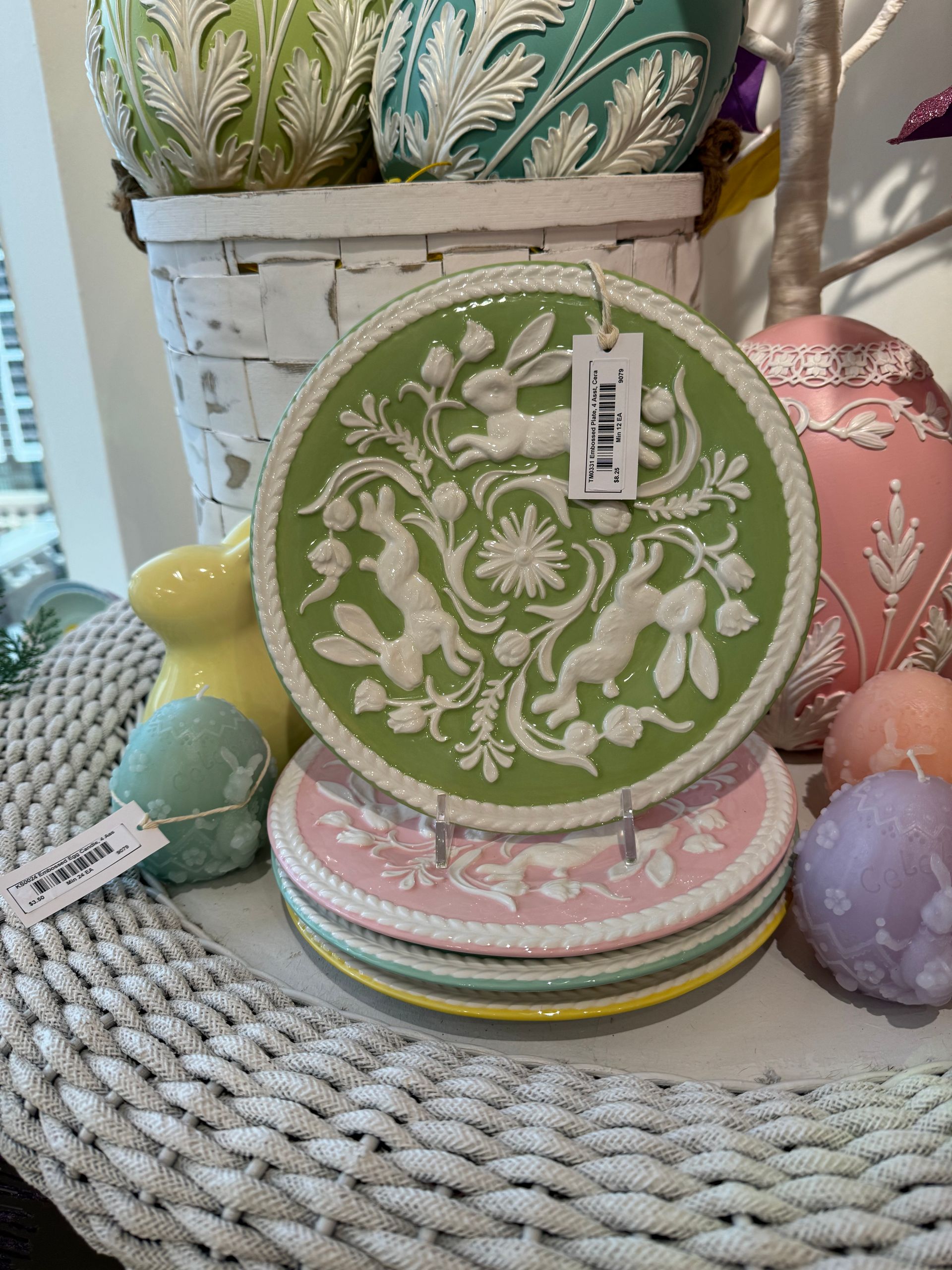 A green plate with white rabbits on it