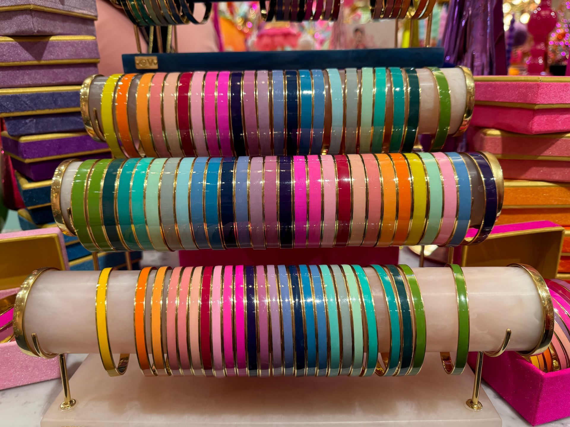 A bunch of colorful bracelets are stacked on top of each other