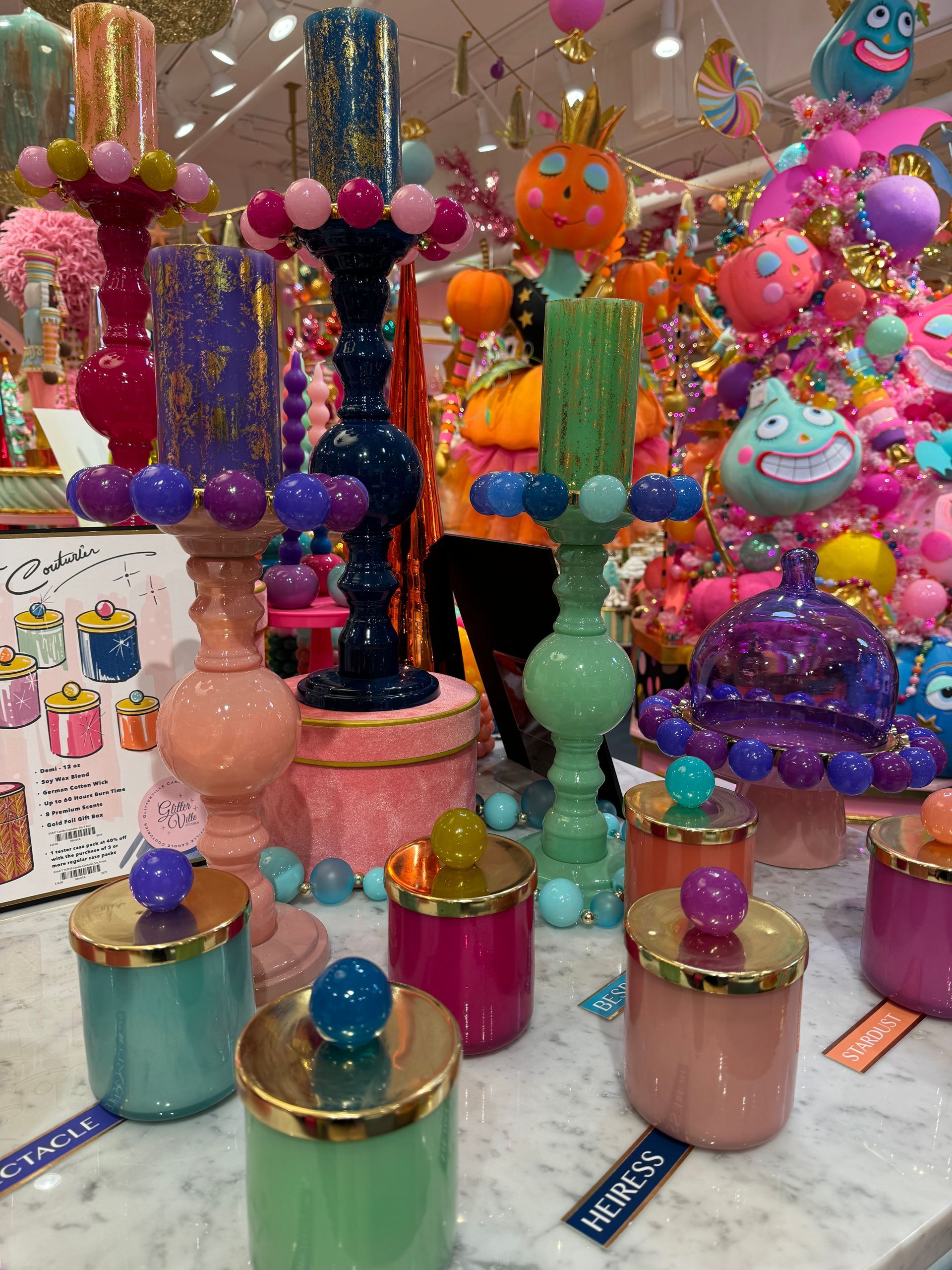 A bunch of colorful candles are on display in a store