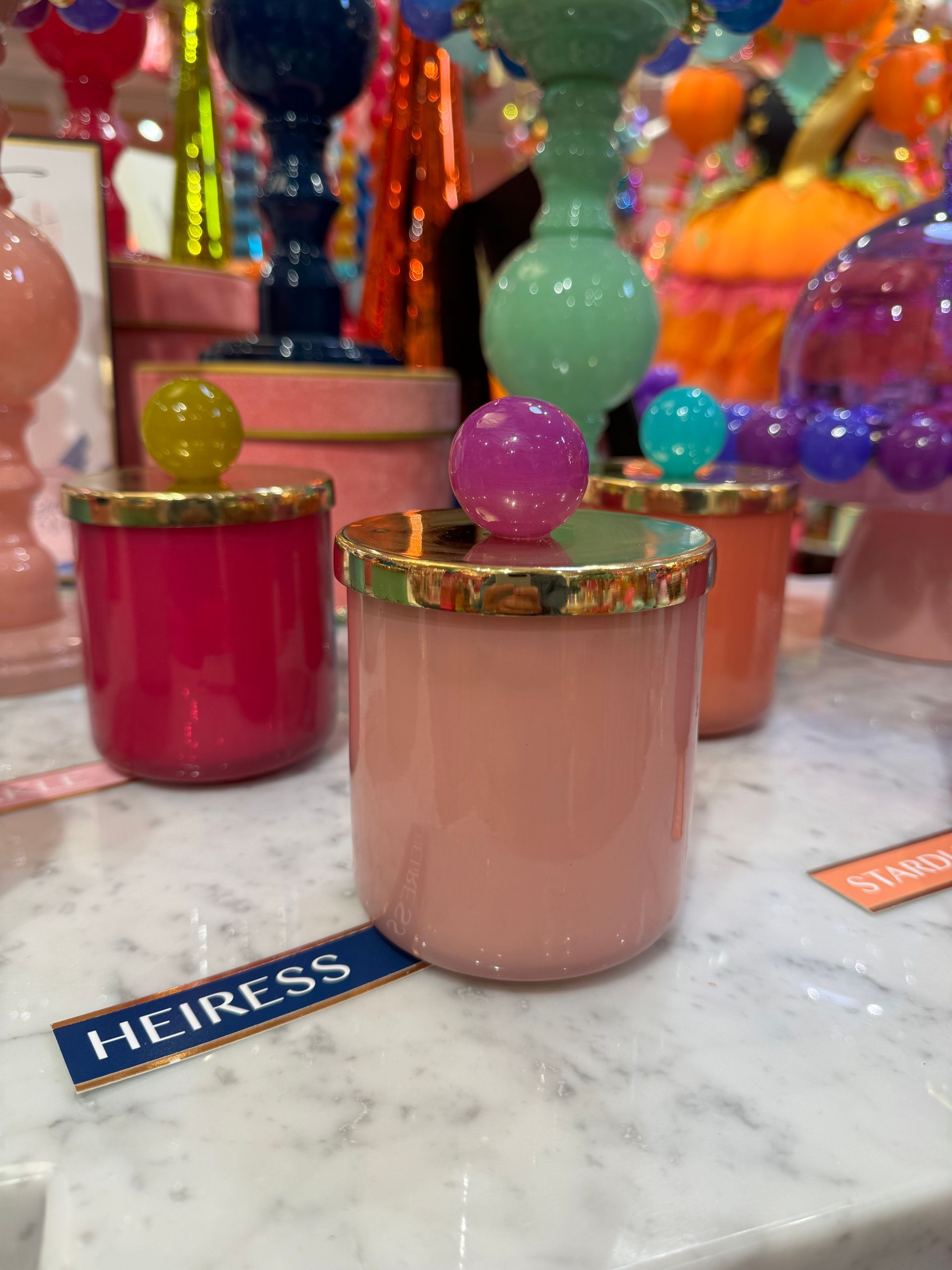 A pink container with the word heiress on it