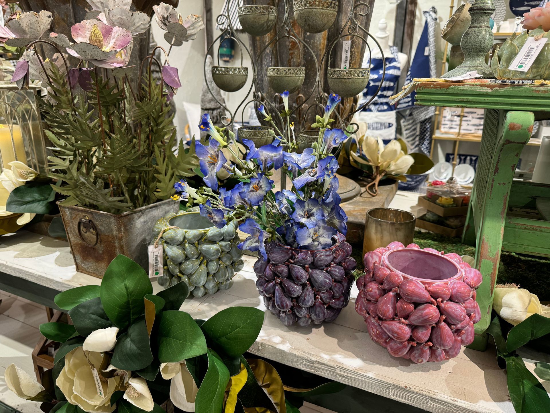A display of flowers and vases on a table