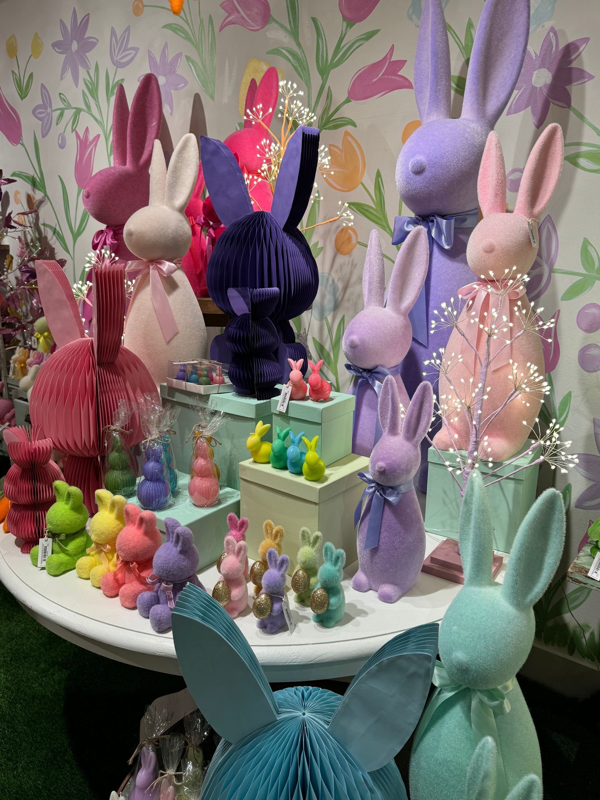 A bunch of stuffed rabbits are sitting on a table