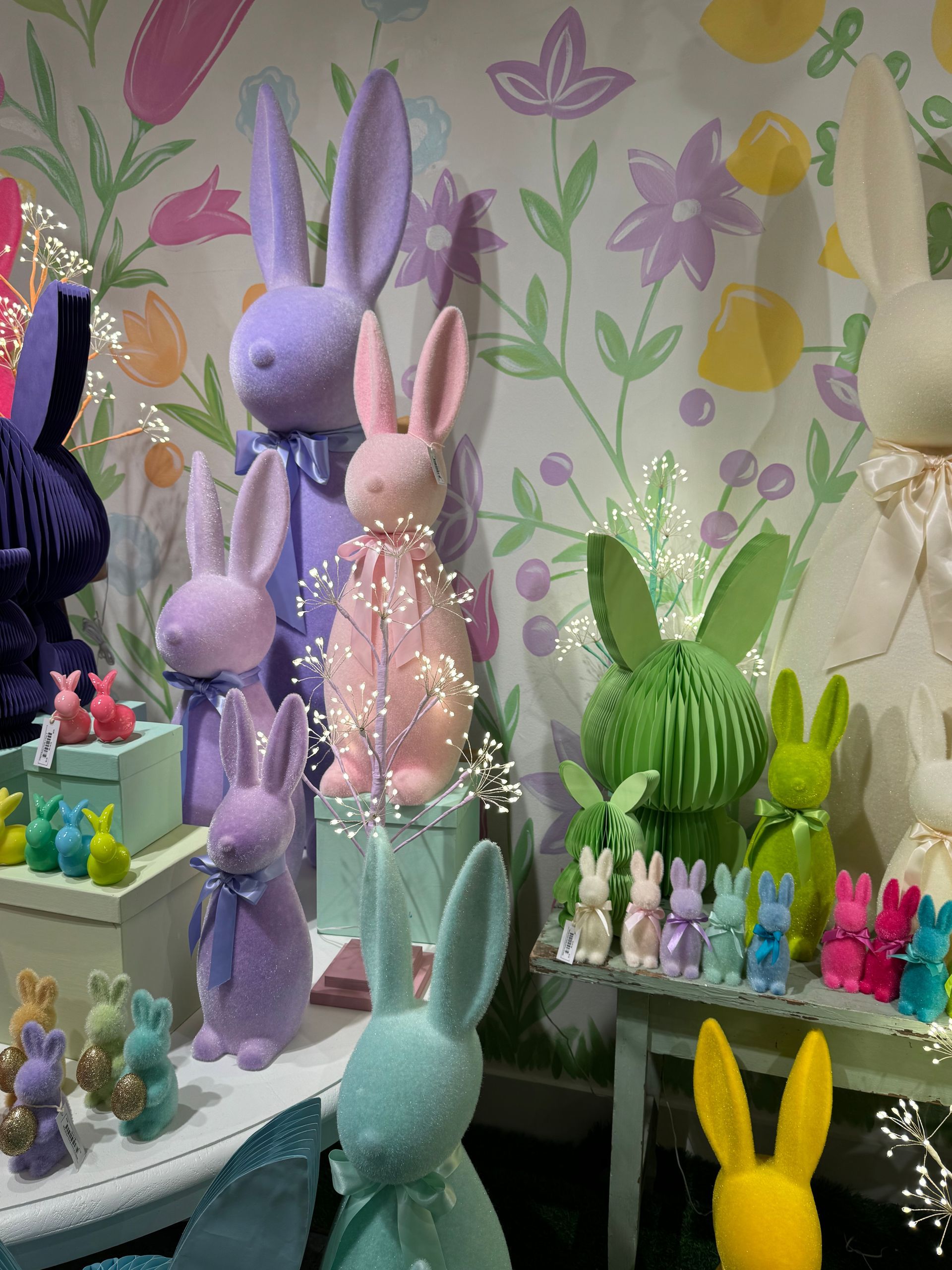 A bunch of stuffed bunny rabbits are on display