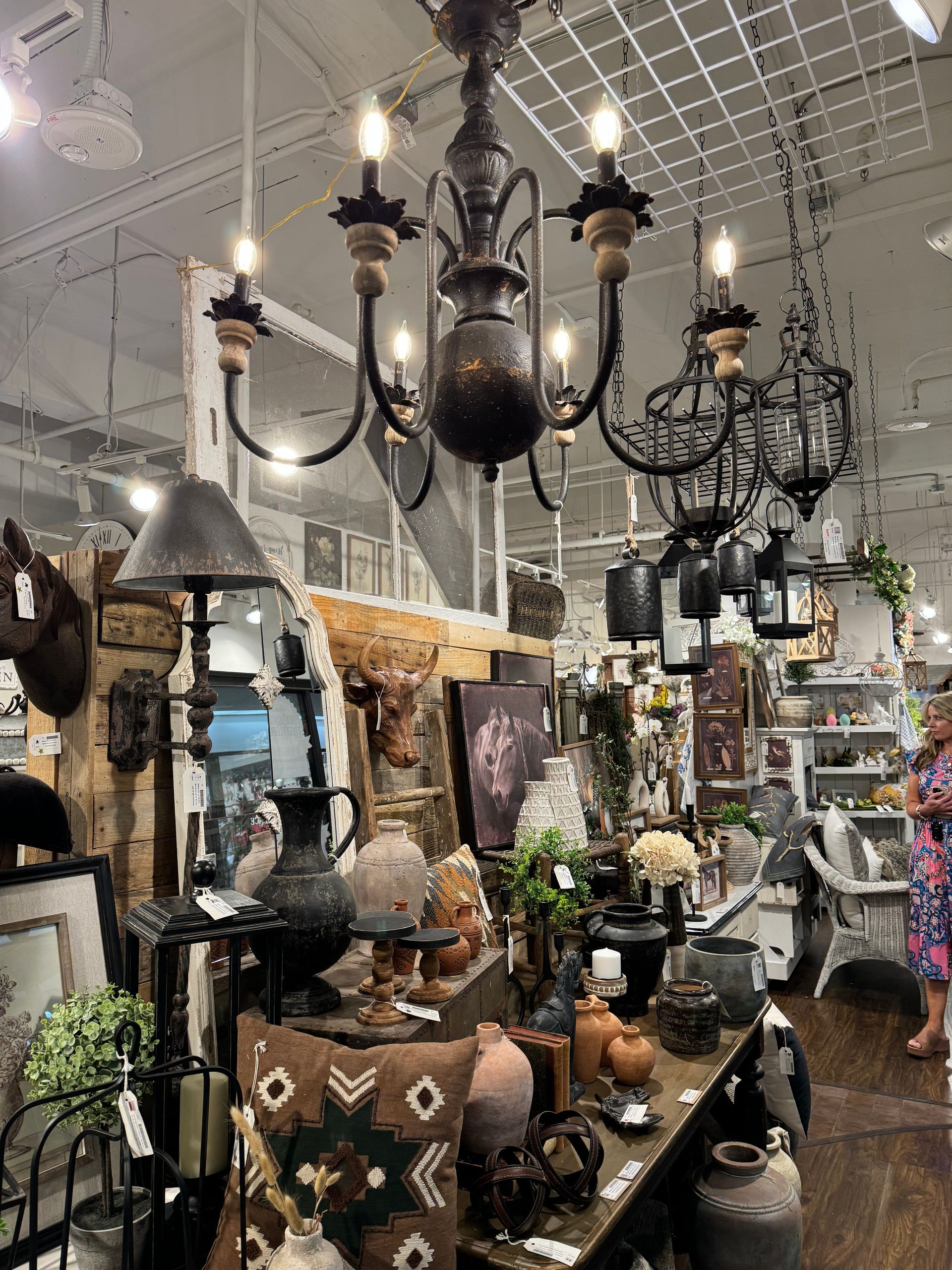 A chandelier is hanging from the ceiling in a store