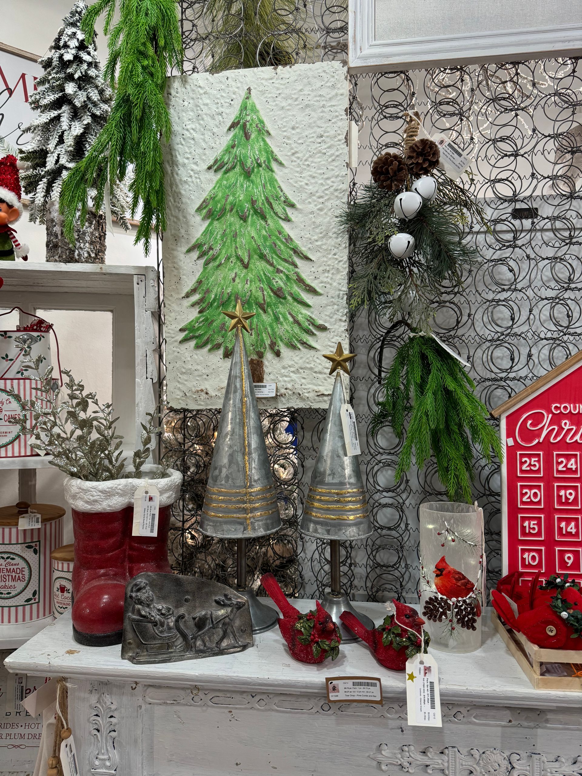 A table with christmas decorations on it including a christmas tree